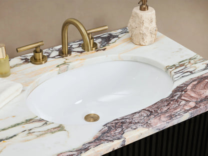 Finnley Double Vanity: Black fluted cabinet, purple-veined marble top, brass hardware. Centered against beige wall on tiled floor.