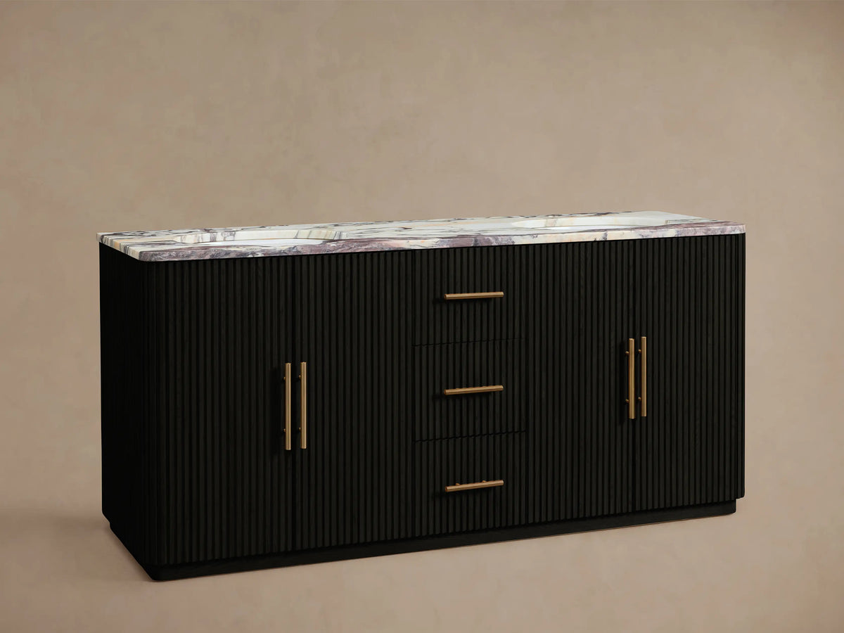 Finnley Double Vanity: Black fluted cabinet with white marble top, purple veining, two gold faucets, and gold bar handles.