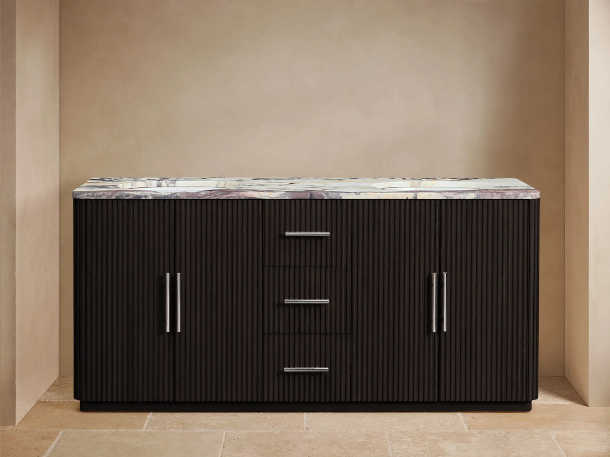 Finnley Double Vanity, dark ribbed wood, Calacatta Viola marble top, two sinks with polished nickel faucets. Left door open, towels visible.