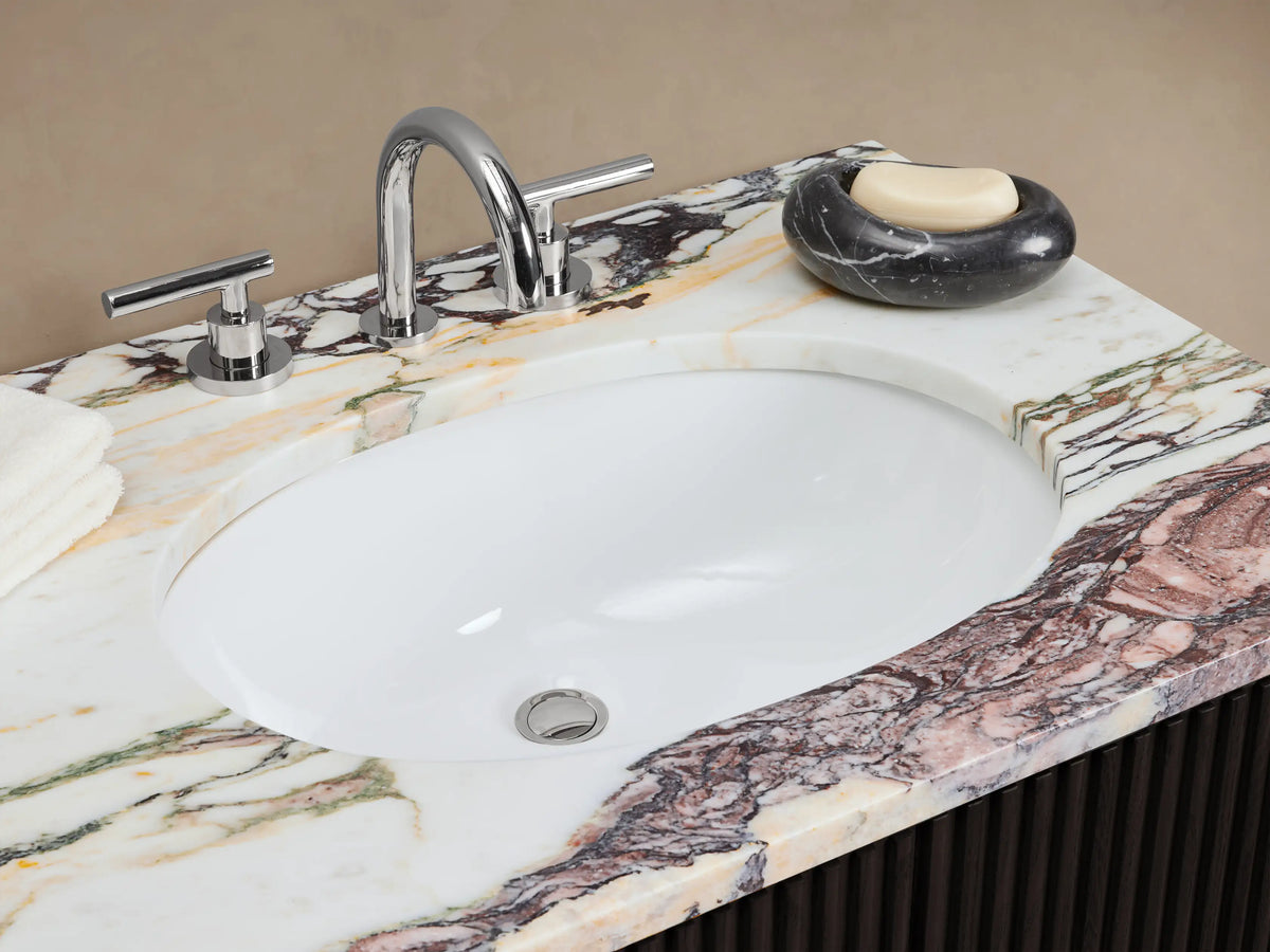 Finnley Double Vanity: dark brown fluted cabinet, white/grey veined marble top, two sinks, and silver bar pulls.