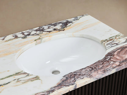 Finnley Double Vanity close-up: white oval sink, multi-colored veined marble top, chrome faucet, white towels, soap dish.