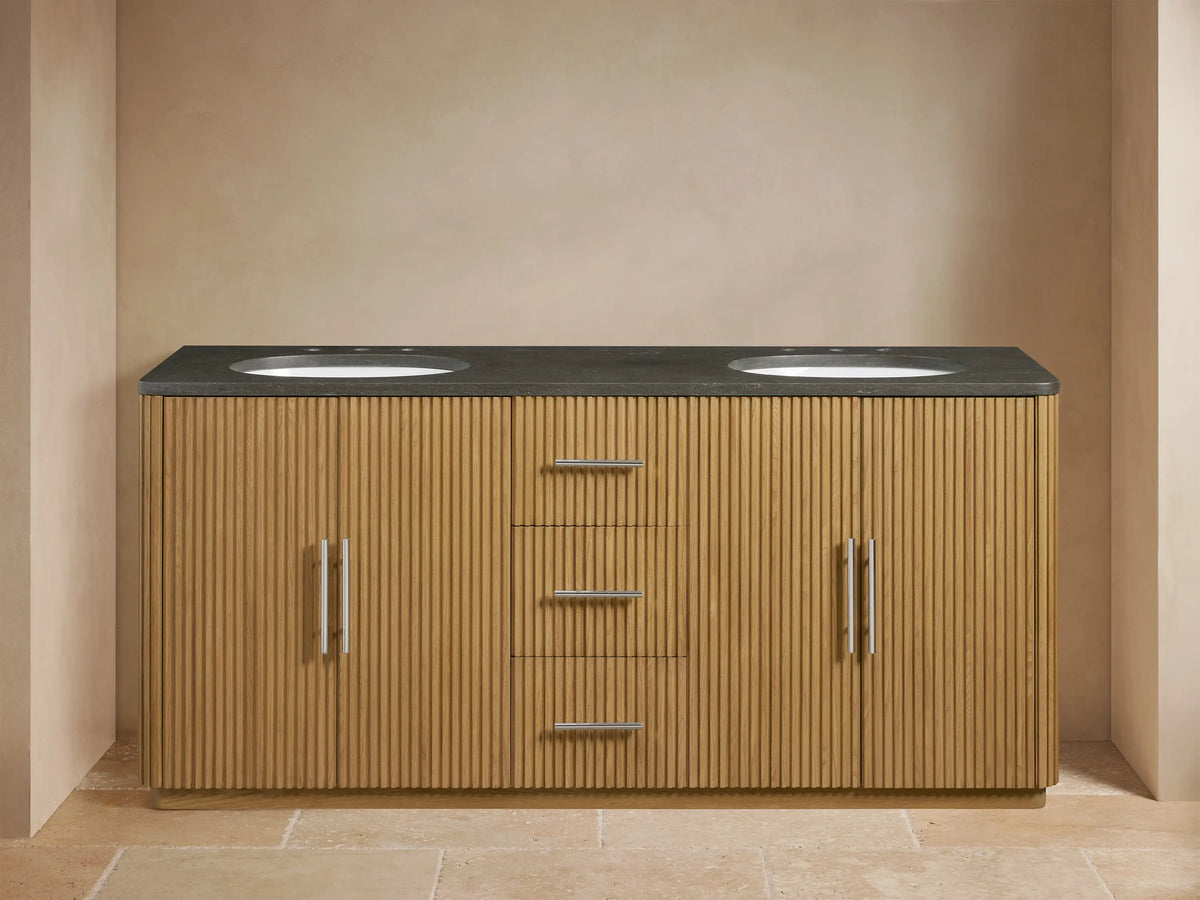 Finnley Double Vanity with oak wood finish, features two oval sinks, a dark stone countertop, open cabinet, and sleek hardware.