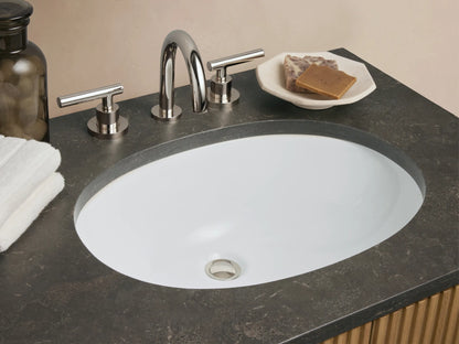 Finnley Double Vanity with vertical oak wood slats, dark stone top, two ceramic sinks, centered drawers, and metal handles.