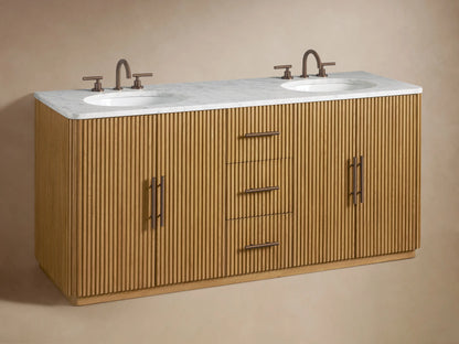 Close-up of Finnley Double Vanity, ribbed oak wood. One drawer open revealing folded beige towels. Dark bronze pulls.