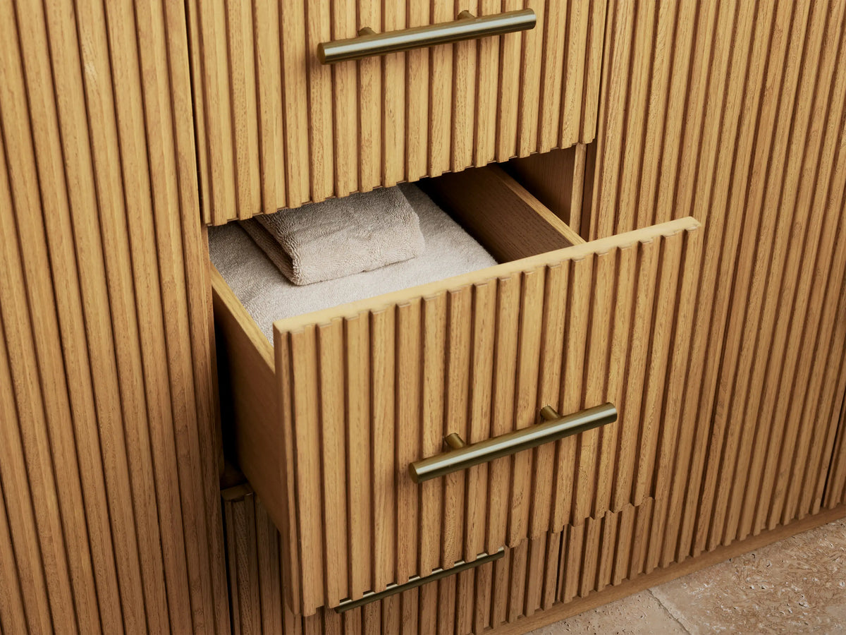 Alt text: Close-up of Finnley Double Vanity's oak wood interior featuring a shelf with folded white towels and a natural sponge in a dish.