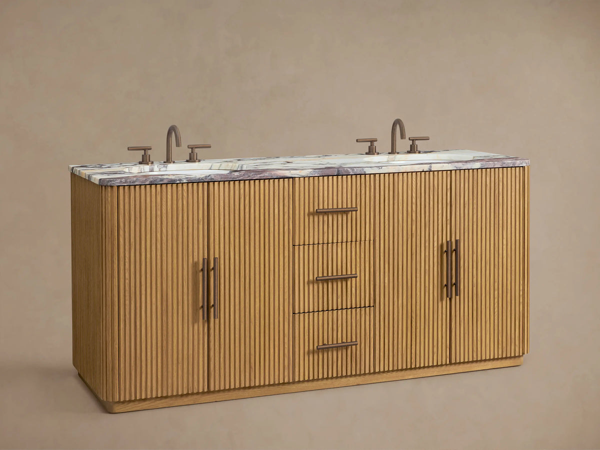 Close-up of Finnley Double Vanity's oak ribbed cabinet door with a dark handle, revealing white towels on an interior shelf.