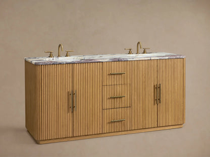 Finnley Double Vanity, close-up of fluted oak wood with reddish marble top. Open drawer holds white towels & bottles.