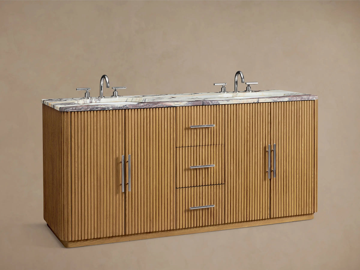 Finnley Double Vanity: Open oak cabinet door with ribbed texture, polished nickel handle, revealing white towels on shelves.