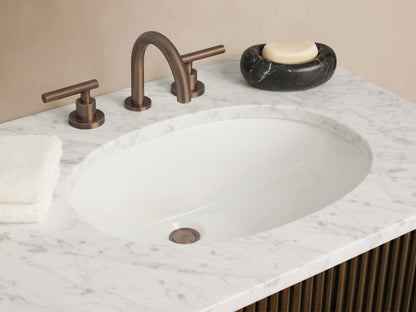 Finnley Double Vanity with white marble top, two oval sinks, and dark fluted wood base with two doors and three central drawers.