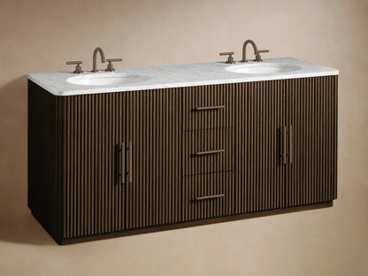 Close-up of Finnley Double Vanity's open dark wood cabinet. Fluted door, dark handle. Inside: natural sponge in white bowl, stacked white towels.