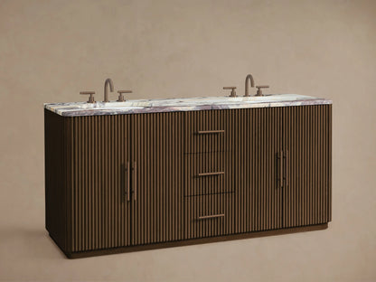 Finnley Double Vanity: Dark fluted wood base, light marble top with purple veining, two dark faucets, left door open revealing towels.