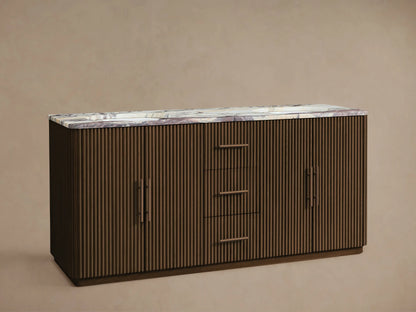 Finnley Double Vanity: Dark brown fluted wood cabinet, white, purple, grey marbled top with two bronze widespread faucets, center drawers, and side doors.