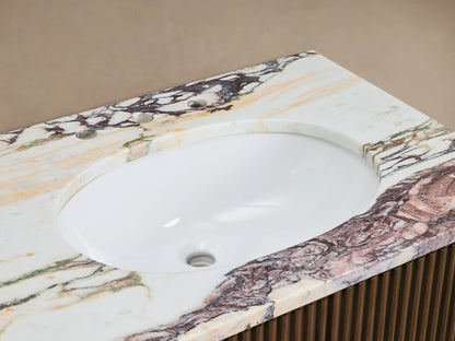 Finnley Double Vanity: White oval sink in Calacatta Viola marble top with rich reddish-brown veining, bronze faucet. Ribbed wood base.