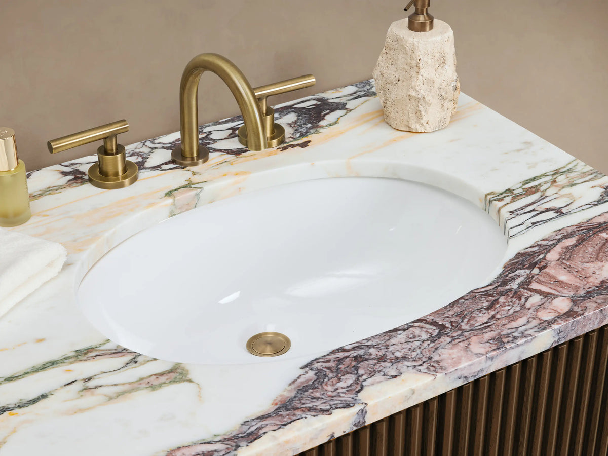 Finnley Double Vanity; dark brown fluted wood cabinet with Calacatta Viola marble top; 3 drawers, 2 doors each side; brass hardware.