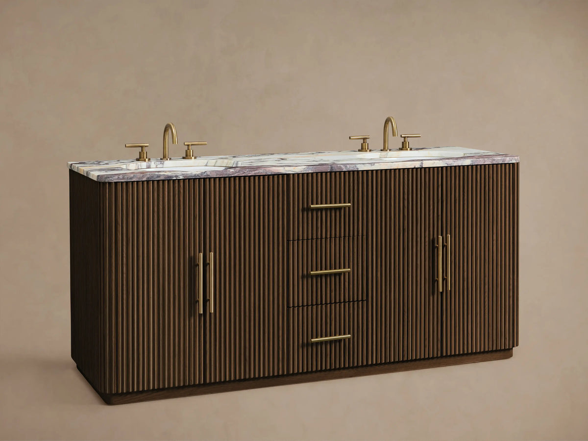 Finnley Double Vanity: Dark fluted wood cabinet door with a gold handle slightly ajar, revealing white towels on a shelf inside.