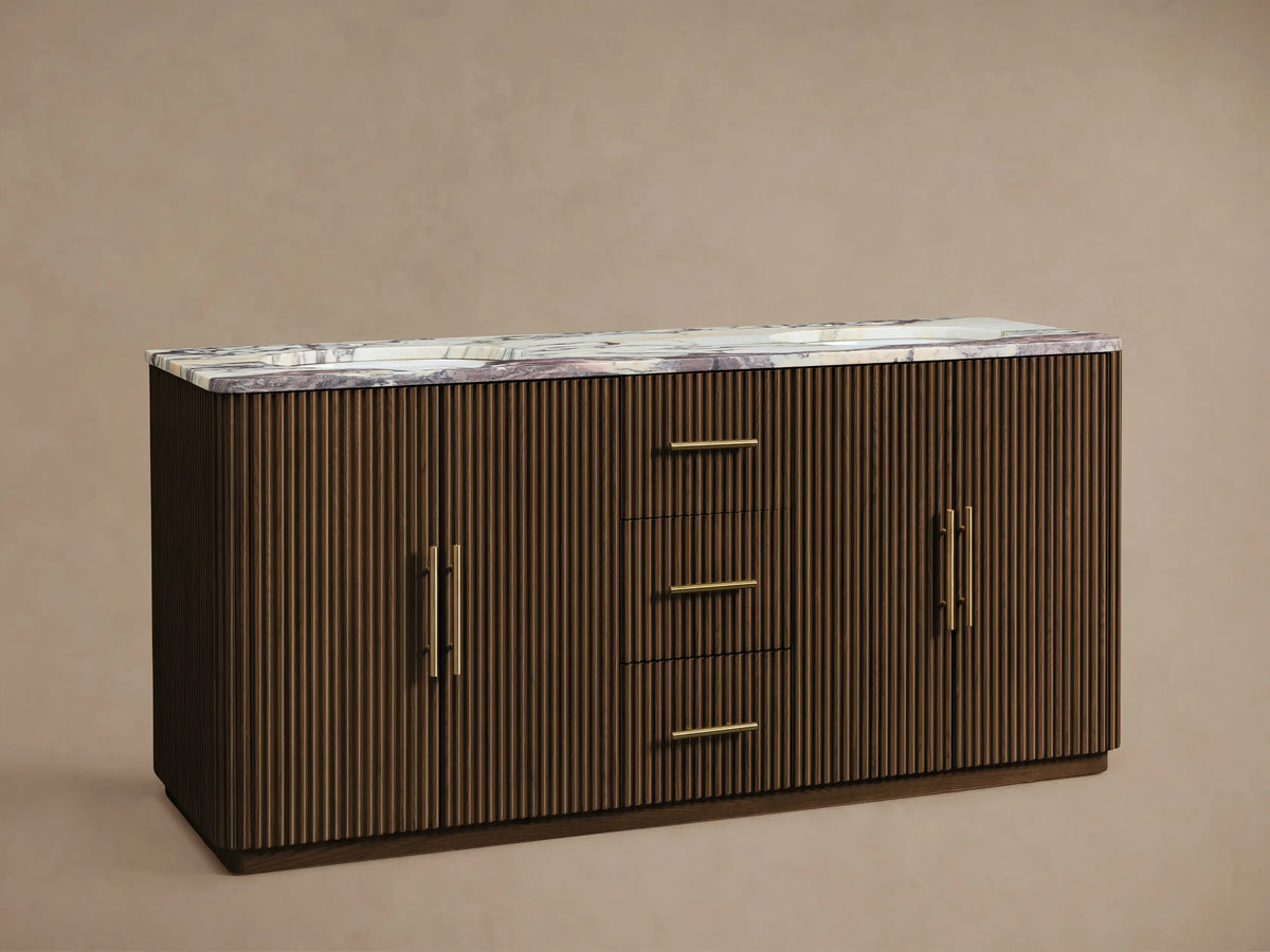 Finnley Double Vanity: dark brown reeded wood, white/purple marble top, gold faucets, and gold bar pulls on doors/drawers.