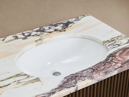 Finnley Double Vanity with white oval sink, marble top with pink, green, brown veins, chrome faucet, ribbed wood cabinet.