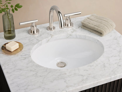 Dark oak Finnley Powder Vanity with vertical ribbed texture, white stone top, oval sink, and silver handles on a beige tiled floor.