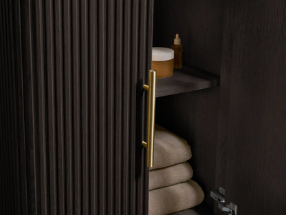Close-up of Finnley Powder Vanity, showing a white oval undermount sink in a light marble top with dark veining and 3 faucet holes.