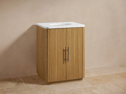 Finnley Powder Vanity: Light oak wood cabinet with vertical fluting, white marble top, oval sink, and dark bronze faucet.