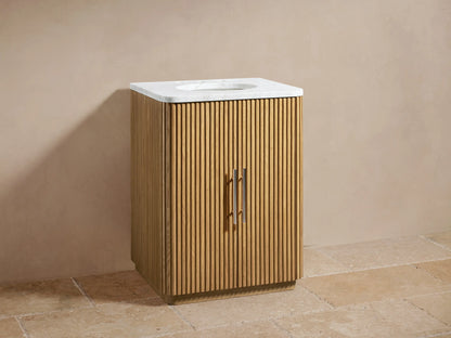 Finnley Powder Vanity with slatted oak wood finish, Carrara marble top, dual faucets, and oval sink, against a beige wall.