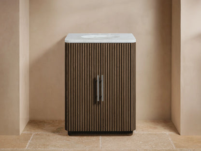 Finnley Powder Vanity: Dark ribbed oak wood cabinet, white Carrara marble top with sink & silver faucet in a modern bathroom.