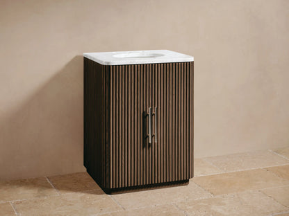 Finnley Powder Vanity: Dark brown fluted wood cabinet, white marble top, oval sink, chrome faucet, beige room.