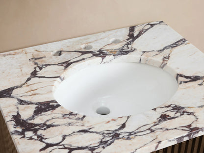 Finnley Powder Vanity with white and purple-veined marble top, white oval sink, and bronze widespread faucet.