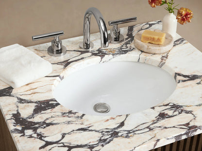 Finnley Powder Vanity, dark brown fluted wood cabinet with white marble top, oval sink, and chrome widespread faucet.
