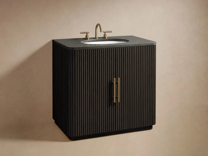 Open Finnley Single Vanity cabinet showing black ribbed door, antique brass handle, and shelves with towels and accessories.