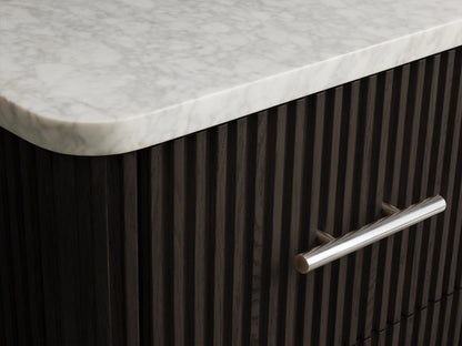 Finnley Short Bath Cabinet open drawer, dark fluted oak with polished nickel pull, holding neatly folded white towels.