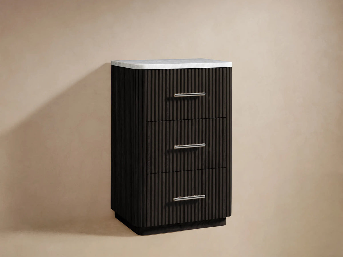 Finnley Short Bath Cabinet: close-up of white marble top, dark brown ribbed oak cabinet, polished nickel pull handle.