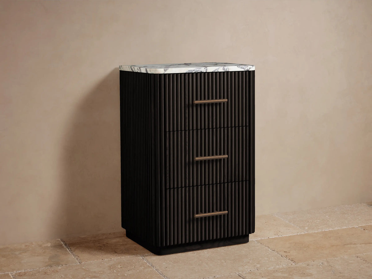 Finnley Short Bath Cabinet: dark slatted wood drawer, partially open, with an antique bronze handle & two cream towels.