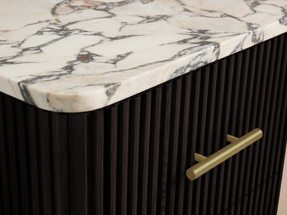 Finnley Short Bath Cabinet's open dark fluted drawer with brass pull, containing two neatly folded beige towels.