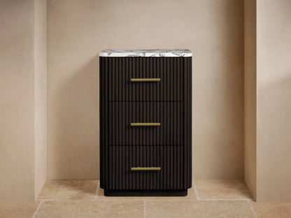 Angled close-up of Finnley Short Bath Cabinet: honed veined marble top, dark ribbed wood, antique brass handle.
