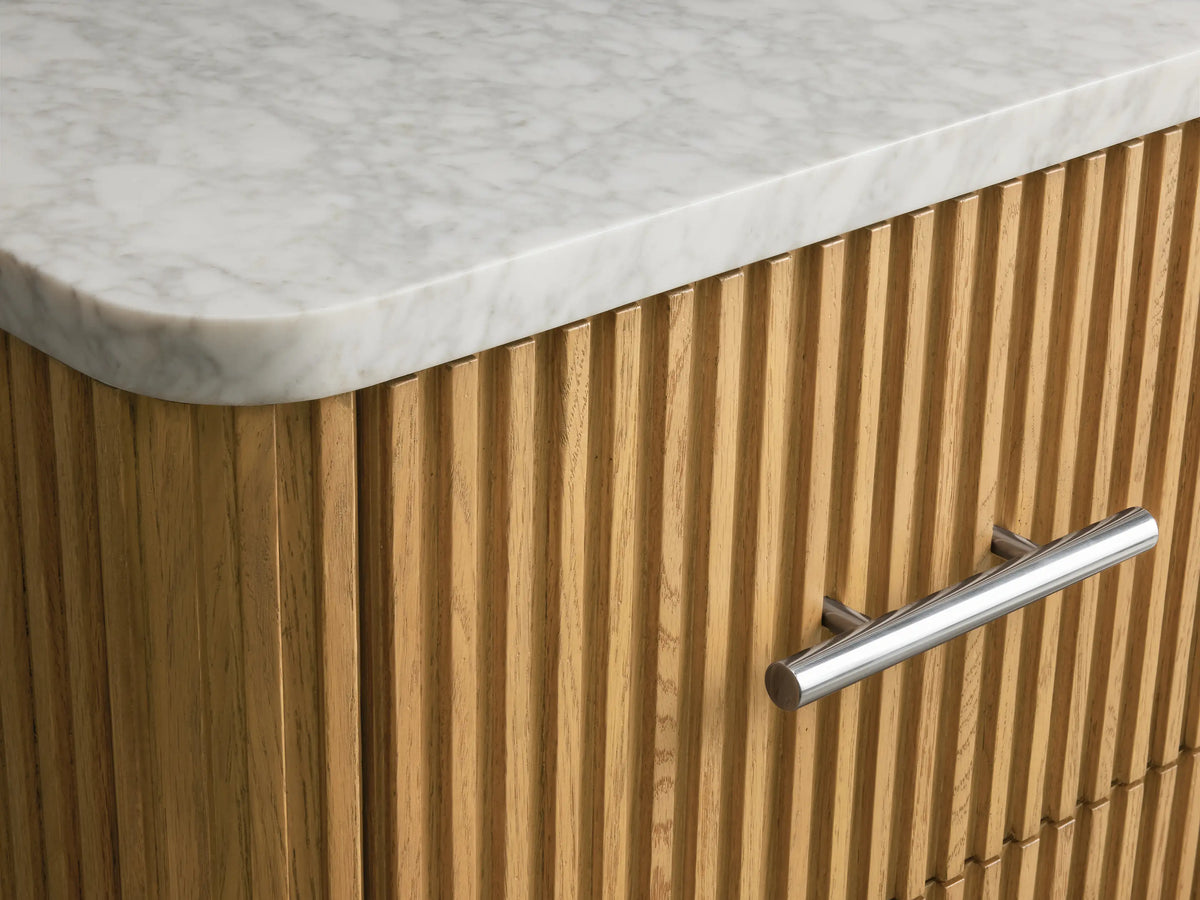 Finnley Short Etagere with ridged oak wood drawer partially open, revealing neatly folded white towels inside. Silver handle visible.