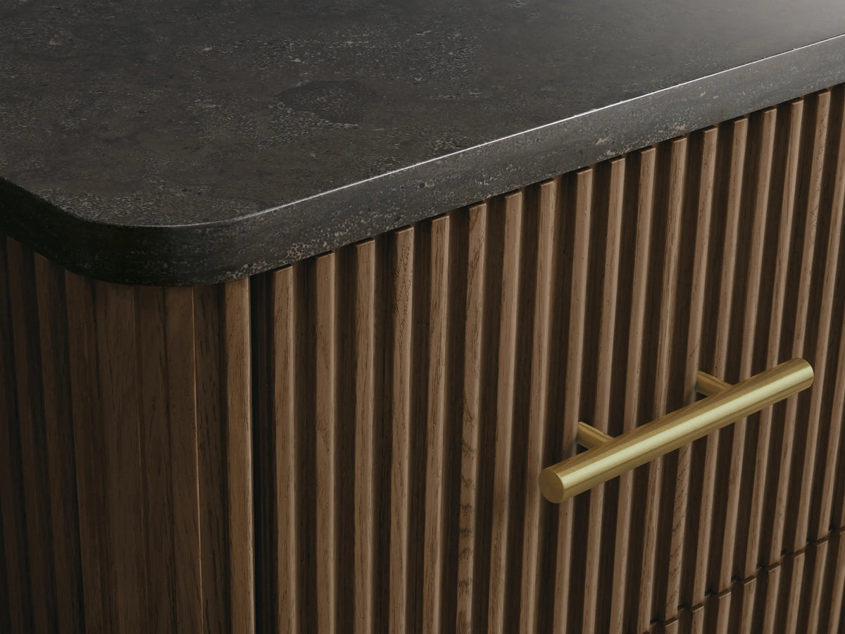 Finnley Short Bath Cabinet: Open oak wood drawer with ribbed front, holding neatly folded white towels, and a brass pull handle.