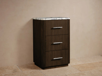 Finnley Short Bath Cabinet, dark brown fluted wood, white marble top with gray veins, 3 drawers with polished nickel handles.