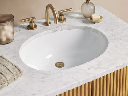 Finnley Single Vanity with ribbed oak wood finish, two vertical metal handles, and a white stone top featuring an oval sink.