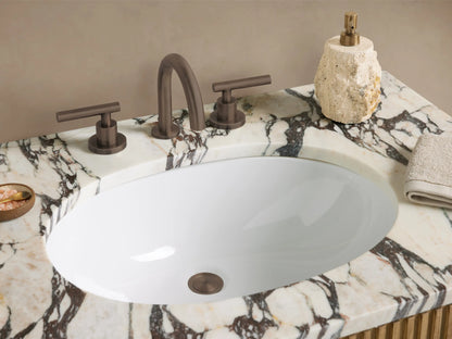 Finnley Single Vanity. Light oak fluted wood, white marble top with gray veining, oval sink, and dark metal handles.