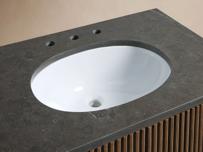 Close-up of Finnley Single Vanity. Dark bluestone top, white oval sink, polished nickel faucet, wood-slatted base.