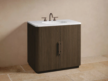 Open ribbed dark oak door of Finnley Single Vanity. Inside, a wooden shelf holds a rustic bowl above neatly stacked light towels.