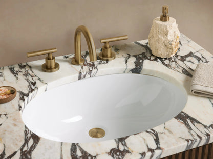Finnley Single Vanity: Dark oak slatted cabinet, white veined Carrara marble top with sink, two brass handles, in a neutral room.