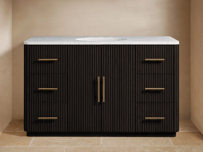 Finnley Single Wide Vanity with dark oak finish, six brass-handled drawers, white stone top, and dual faucets on tile floor.