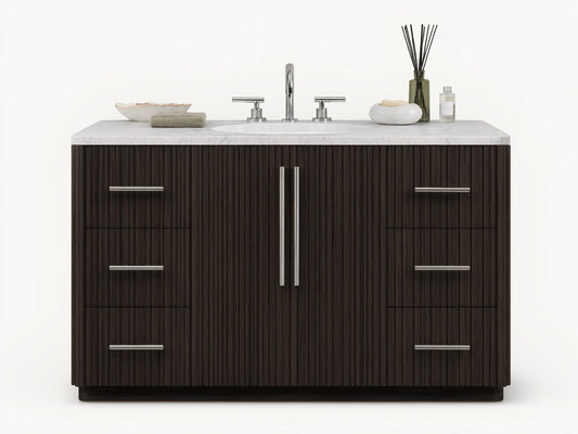 The image shows the Finnley Single Wide Vanity with a dark oak finish. It has a white stone top and an oval ceramic sink, with silver hardware on six drawers and two central doors.