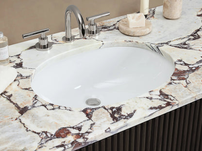 Dark brown fluted Finnley Wide Single Vanity with white marble top, oval sink, and polished nickel hardware, front right view.