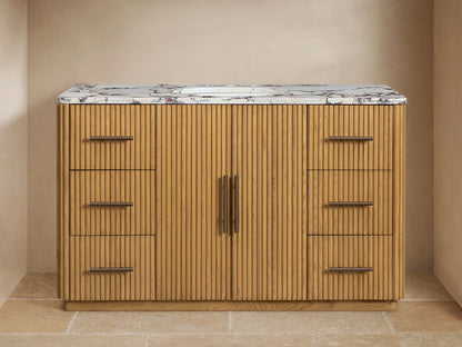 Finnley Wide Single Vanity: Oak fluted cabinet, white marble top with oval sink, bronze widespread faucet, and hardware, two doors, six drawers.