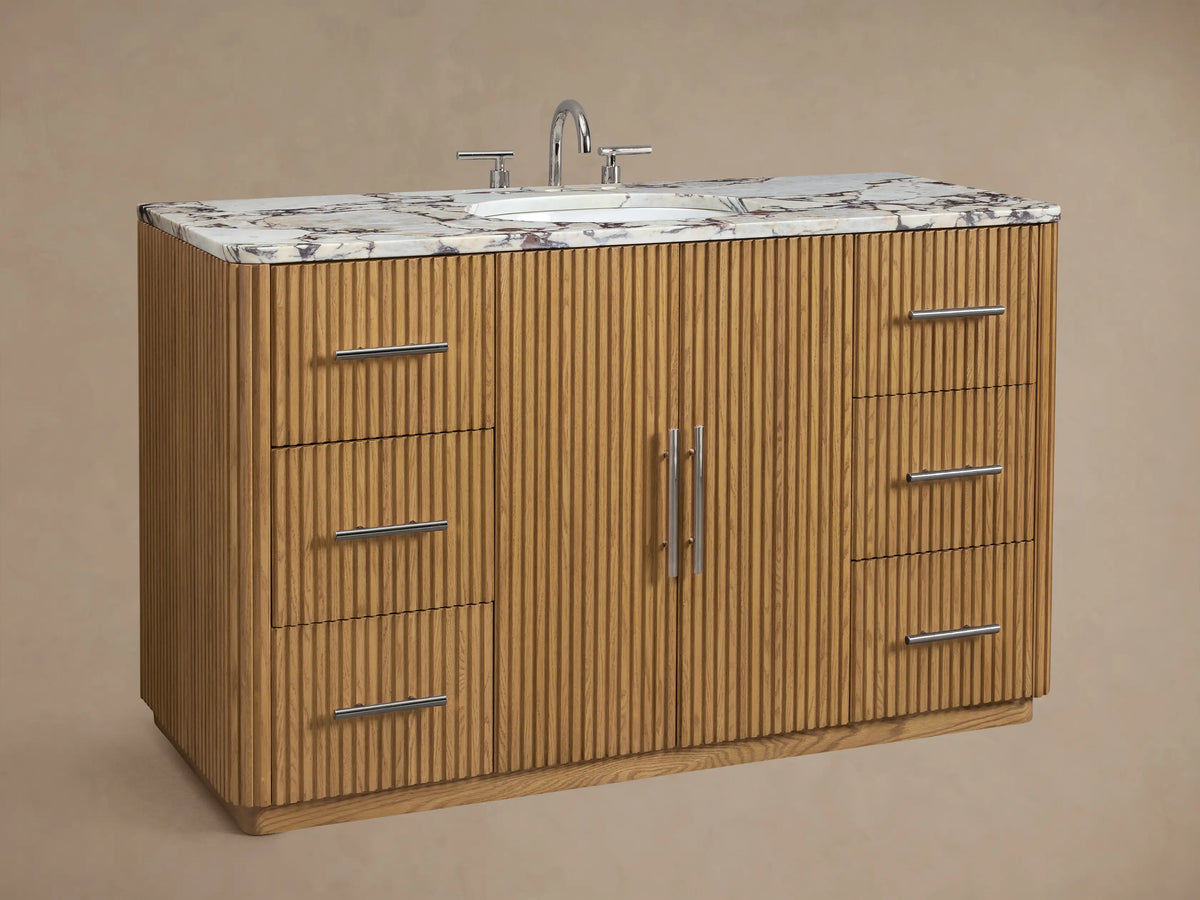 Finnley Wide Single Vanity, light fluted oak wood, white marble top, white oval sink, chrome faucet, 5 drawers & doors.
