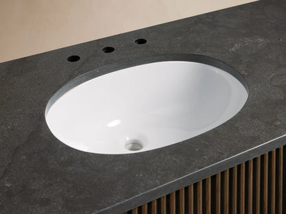 Finnley Wide Single Vanity close-up: white oval undermount sink, dark stone counter, bronze widespread faucet, slatted wood base.