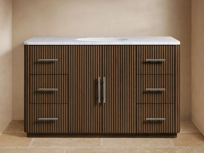 Finnley Wide Single Vanity, dark brown ribbed wood base with white marble top, oval sink, chrome faucet, 6 drawers, 2 cabinet doors.